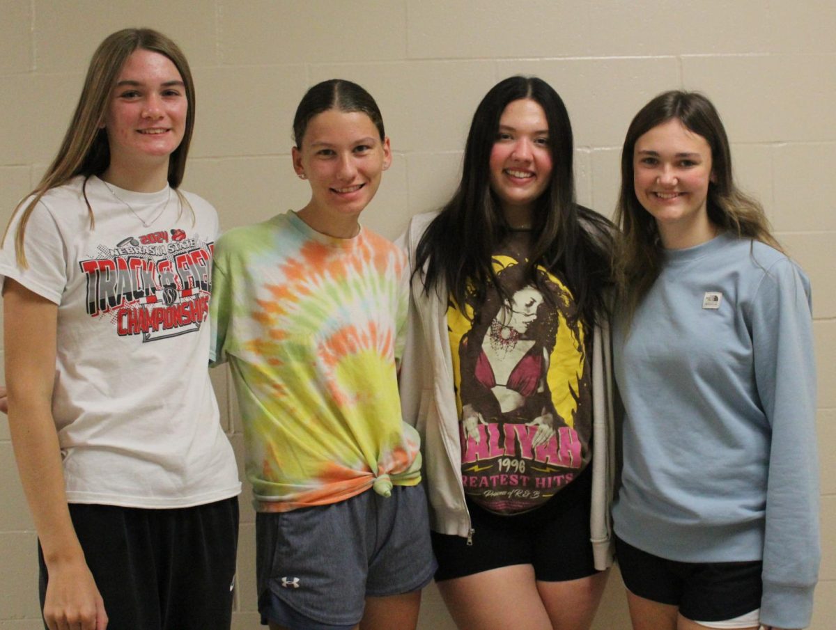 LIz Wemhoff, Hannah Moser, Virgina Olson and Lexi Urkoski are four of the five seniors on the AnchorNews staff. Hazel Coufal was absent for the photo.